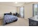 Bedroom with carpet, neutral walls, and natural light is perfect for relaxing or studying at 5111 Elementary View Dr, Charlotte, NC 28269