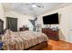 Spacious bedroom with a ceiling fan, hardwood floors, and neutral paint presents a modern and serene atmosphere at 5111 Elementary View Dr, Charlotte, NC 28269