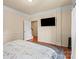 Cozy bedroom with a large window, wood floors, and neutral walls provides a comfortable space at 5111 Elementary View Dr, Charlotte, NC 28269