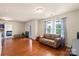 Bright bonus room with hardwood floors, comfortable seating, and natural light at 5111 Elementary View Dr, Charlotte, NC 28269