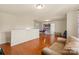 Spacious bonus room offers flexible living with hardwood flooring and neutral paint at 5111 Elementary View Dr, Charlotte, NC 28269