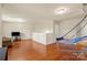 Upstairs bonus room with lots of natural light, comfortable seating and neutral walls at 5111 Elementary View Dr, Charlotte, NC 28269