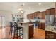 Modern kitchen boasts stainless steel appliances, an island with bar seating, and plenty of cabinetry at 5111 Elementary View Dr, Charlotte, NC 28269