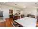 Spacious area showing the kitchen, dining, and living area complete with wood floors and ample light at 5111 Elementary View Dr, Charlotte, NC 28269