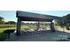 A picnic shelter featuring stone columns, picnic tables, and a grill offers a great place to spend time outdoors at 5111 Elementary View Dr, Charlotte, NC 28269