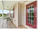 Inviting covered front porch with wooden floors and comfortable seating area at 5111 Elementary View Dr, Charlotte, NC 28269