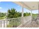 Covered front porch with seating offers a relaxing view of the neighborhood at 5111 Elementary View Dr, Charlotte, NC 28269