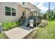 Backyard with a stainless steel grill, shaded deck and mature landscaping at 512 Rosebush Ln, Clover, SC 29710