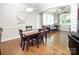 Formal dining room with wood floors, decorative lighting, and adjacent living space at 512 Rosebush Ln, Clover, SC 29710