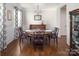 Elegant dining room features wood floors, wainscoting, and classic chandelier at 512 Rosebush Ln, Clover, SC 29710