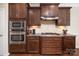 Kitchen boasts stainless appliances, including oven, microwave, and gas range, complemented by granite countertops at 512 Rosebush Ln, Clover, SC 29710