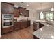 Well-appointed kitchen features granite countertops, stainless steel appliances, and ample cabinet space at 512 Rosebush Ln, Clover, SC 29710