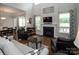 Cozy living room with a fireplace, hardwood floors, and ample natural light at 512 Rosebush Ln, Clover, SC 29710