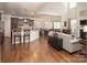 Spacious living area featuring hardwood floors, an open layout, and a modern kitchen at 512 Rosebush Ln, Clover, SC 29710