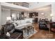 Open-concept living space with hardwood floors, comfortable seating, and a view of the kitchen at 512 Rosebush Ln, Clover, SC 29710