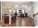 Open concept living area featuring wood floors, a fireplace, and seamless flow from the kitchen at 512 Rosebush Ln, Clover, SC 29710