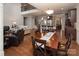 Open floor plan showcasing the living room, dining area, and kitchen with hardwood floors at 512 Rosebush Ln, Clover, SC 29710