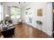 Bright sun room with wood floors, garden view, and access to outdoor space at 512 Rosebush Ln, Clover, SC 29710