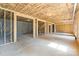 Open basement area with visible framing, exposed insulation, and concrete floors provides a customizable space at 5526 Brookwood Ln, Hickory, NC 28602