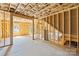 Bright basement area with visible insulation, framing and concrete floors provides a customizable space at 5526 Brookwood Ln, Hickory, NC 28602