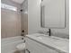 Elegant bathroom featuring bathtub, toilet, and marble countertop vanity with mirror at 5526 Brookwood Ln, Hickory, NC 28602