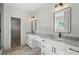 Stylish bathroom featuring double vanity with marble countertop and modern lighting at 5526 Brookwood Ln, Hickory, NC 28602