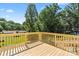 New wooden deck overlooking the landscaped backyard of this property. A great place to entertain at 5526 Brookwood Ln, Hickory, NC 28602