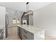 Kitchen island with beverage center next to fireplace; perfect for entertaining in a home at 5526 Brookwood Ln, Hickory, NC 28602
