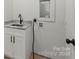 Functional laundry room with cabinet storage, marble countertop, and sink at 5526 Brookwood Ln, Hickory, NC 28602