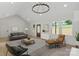 Open living room with vaulted ceilings, large windows, and modern furnishings at 5526 Brookwood Ln, Hickory, NC 28602