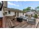 The Backyard deck features outdoor seating, string lights, and a fire pit for entertaining at 5533 Murrayhill Rd, Charlotte, NC 28210