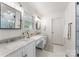 Bright bathroom with double sink vanity, modern fixtures, and stylish geometric-patterned shower at 5533 Murrayhill Rd, Charlotte, NC 28210