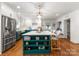 Stunning kitchen featuring a large center island, stainless steel appliances, and hardwood floors at 5533 Murrayhill Rd, Charlotte, NC 28210