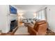 Cozy living room featuring a fireplace, hardwood floors, and comfortable seating at 5533 Murrayhill Rd, Charlotte, NC 28210