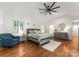 Airy main bedroom featuring a vaulted ceiling, ample natural light, and charming decor at 5533 Murrayhill Rd, Charlotte, NC 28210