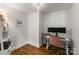Bright home office with hardwood floors, modern desk setup, and ample natural light at 5533 Murrayhill Rd, Charlotte, NC 28210