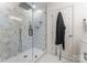 Contemporary shower featuring geometric tile, sleek glass enclosure, and modern shower head at 5533 Murrayhill Rd, Charlotte, NC 28210