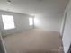 Neutral carpeted bedroom features two large bright windows at 5775 Soft Shell Dr # 310, Lancaster, SC 29720