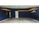 Organized garage features custom paint, shelving, and overhead storage at 5775 Soft Shell Dr # 310, Lancaster, SC 29720