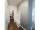 Hallway with coat rack storage, leading to a half bath with a pedestal sink at 5775 Soft Shell Dr # 310, Lancaster, SC 29720