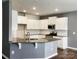 Modern kitchen with stainless steel appliances, granite countertops, and white cabinetry at 5775 Soft Shell Dr # 310, Lancaster, SC 29720