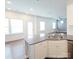 Kitchen with gray countertops, modern appliances, and view to living area and lots of natural light at 5775 Soft Shell Dr # 310, Lancaster, SC 29720