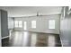 Bright and airy living room with hardwood floors and ample natural light from multiple windows at 5775 Soft Shell Dr # 310, Lancaster, SC 29720