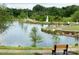 Scenic pond view with a fountain, bike path, bench, and lush landscaping for relaxing outdoor enjoyment at 5775 Soft Shell Dr # 310, Lancaster, SC 29720
