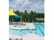 Community pool featuring a large swimming area, sunshades, lounge chairs, and Gathering-friendly amenities at 5775 Soft Shell Dr # 310, Lancaster, SC 29720