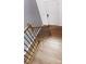 Wooden staircase with iron railings, leading to the upper level of the home and laminate floors at 5775 Soft Shell Dr # 310, Lancaster, SC 29720