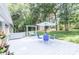 Relaxing back deck space with an umbrella-covered table and comfortable porch swing at 5909 Ryder Ave, Charlotte, NC 28226