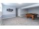 A finished basement featuring a pool table and gray walls with white trim at 5909 Ryder Ave, Charlotte, NC 28226