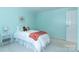 Bright bedroom features a twin bed, blue walls and white trim at 5909 Ryder Ave, Charlotte, NC 28226