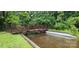 A quiet bridge leads through a lush area in the community at 5909 Ryder Ave, Charlotte, NC 28226